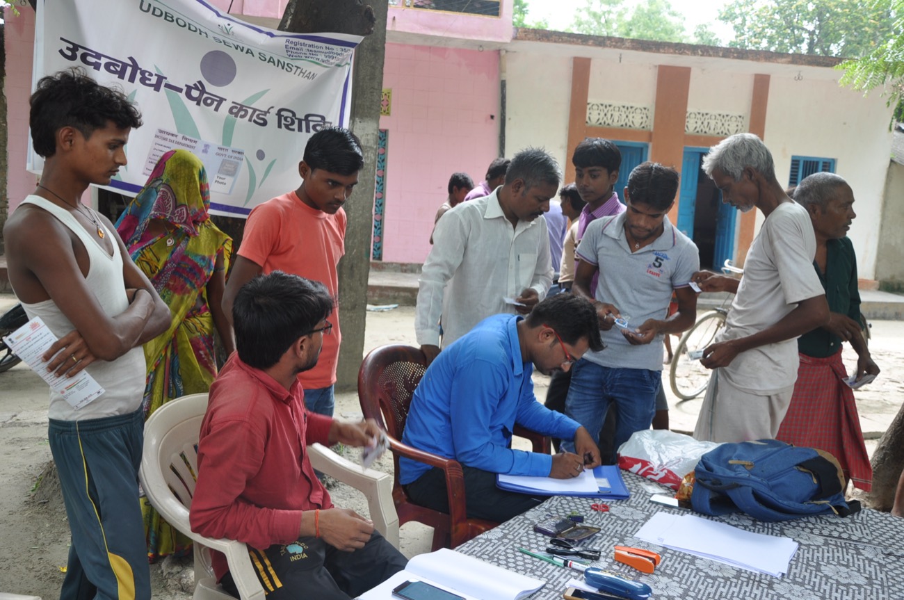 Udbodh volunteers running a PAN-card awareness camp for the community